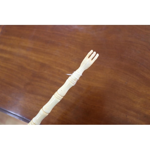 2398 - Carved sectional bone back scratcher, approx 43cm L