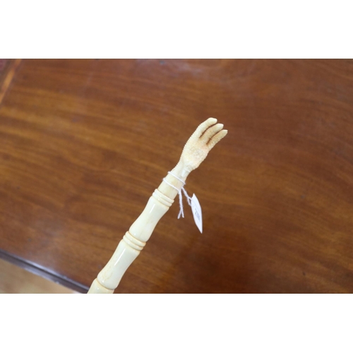 2398 - Carved sectional bone back scratcher, approx 43cm L