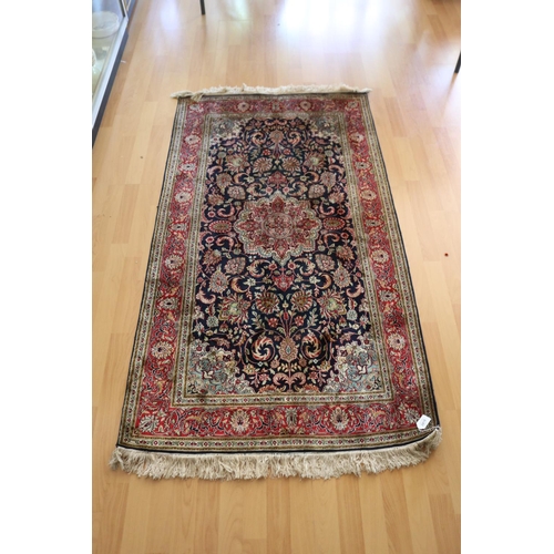 2418 - Fine Dark blue ground silk rug, approx 90cm x 165cm