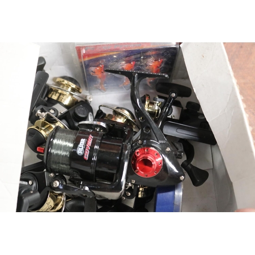 2439 - Box of unused fishing gear - includes reels etc