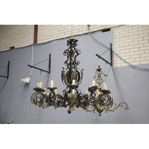 2451 - Large black painted twelve light iron chandelier
