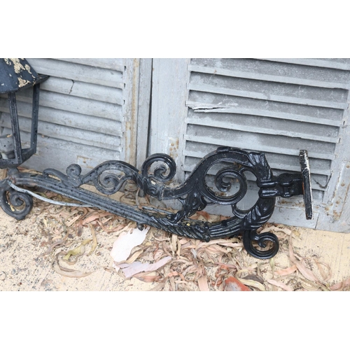46 - Antique French scrolling iron wall bracket with square tapering lantern attached, approx 48cm H x 81... 