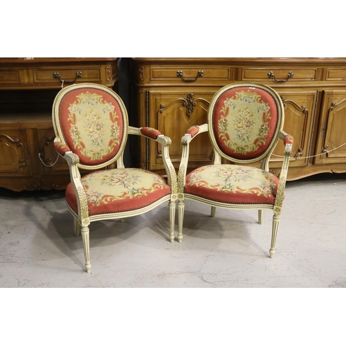 217 - Pair of French Louis XVI style armchairs, painted frames and upholstered in wool work to the backs a... 