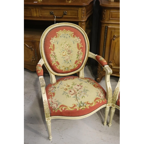 217 - Pair of French Louis XVI style armchairs, painted frames and upholstered in wool work to the backs a... 