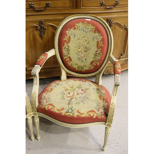 217 - Pair of French Louis XVI style armchairs, painted frames and upholstered in wool work to the backs a... 