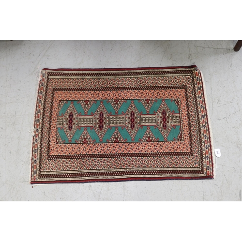 398 - Small handwoven wool carpet, approx 63cm x 92cm