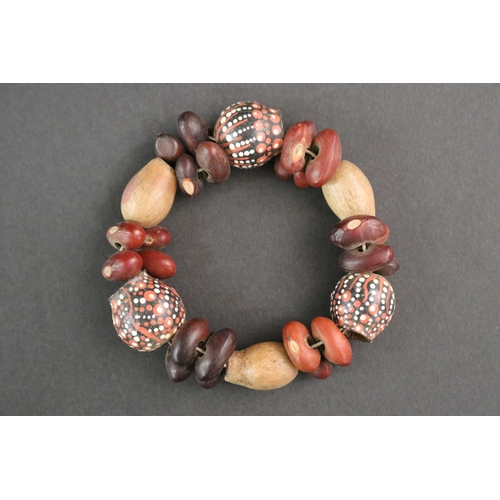 489 - Lisa Pultara (c1959-.) Australia (Aboriginal deceased) Painted bracelet, bean tree & gumnut, 87, Anm... 