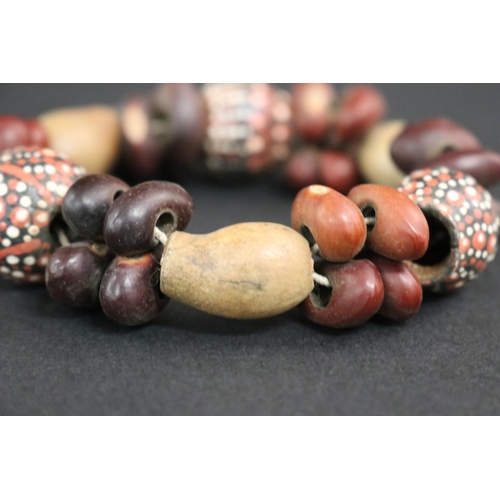 489 - Lisa Pultara (c1959-.) Australia (Aboriginal deceased) Painted bracelet, bean tree & gumnut, 87, Anm... 