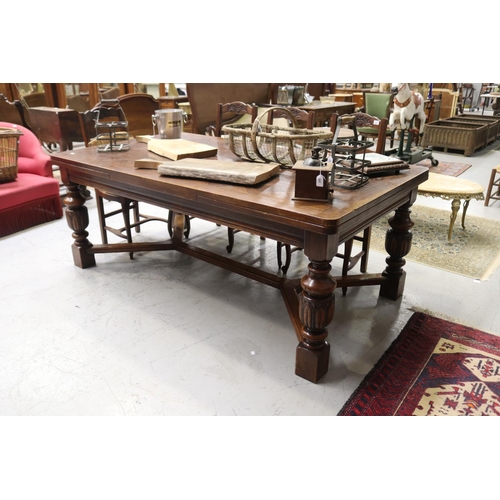 246 - Large early 20th century French oak table, with drawer leaves to the ends. All standing on carved ba... 