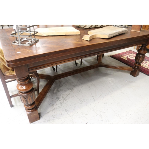 246 - Large early 20th century French oak table, with drawer leaves to the ends. All standing on carved ba... 