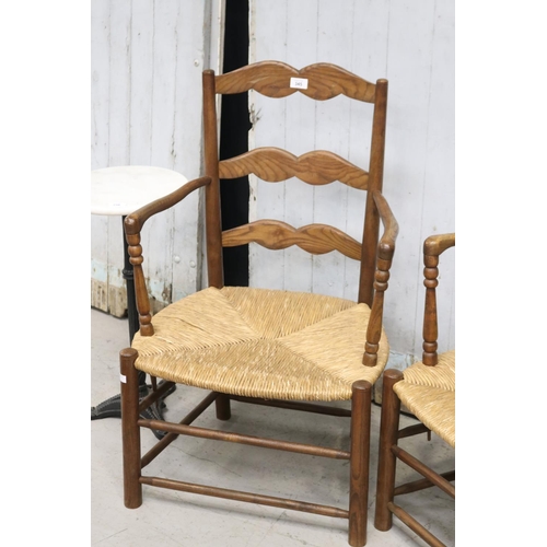 345 - Pair of French ladder back rush seated country arm chairs (2)