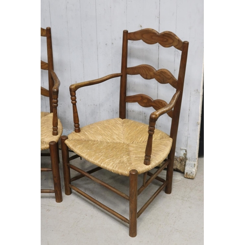 345 - Pair of French ladder back rush seated country arm chairs (2)
