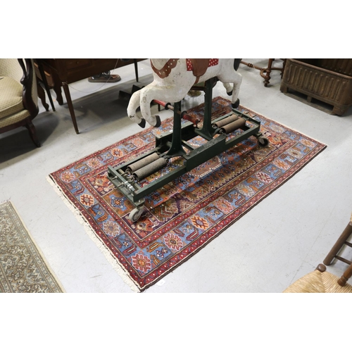 259 - Hand woven wool carpet, approx 128cm x 210cm