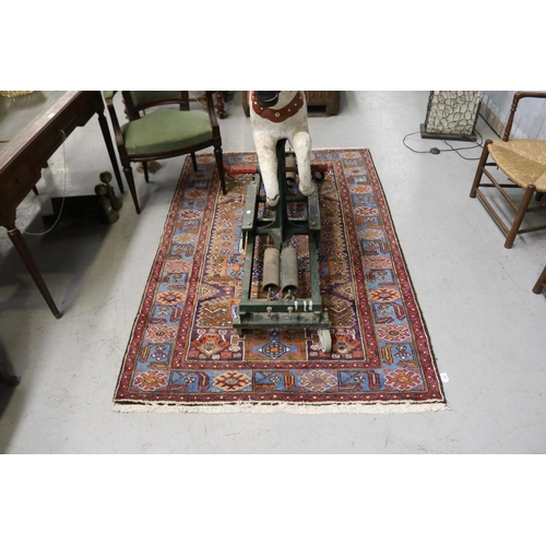 259 - Hand woven wool carpet, approx 128cm x 210cm