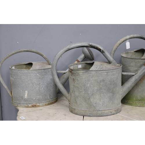 445 - Three French rustic gal metal watering cans, approx 43cm H x 63cm W and smaller (3)