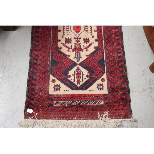 236 - Handwoven red ground wool rug, approx 84cm x 175cm