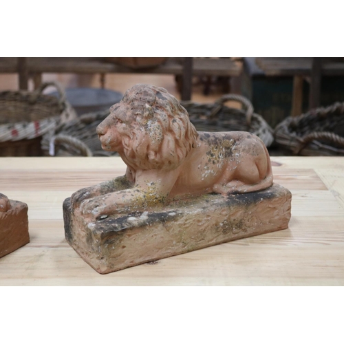 62 - Pair of terracotta garden lions, both seated on plinth, each approx 25cm H x 34cm L (2)