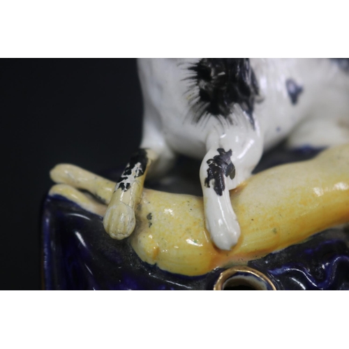 5092 - Antique Staffordshire figural spill vase, showing dog & hare, has damages, approx 7cm H x 12cm W