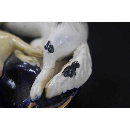 5092 - Antique Staffordshire figural spill vase, showing dog & hare, has damages, approx 7cm H x 12cm W