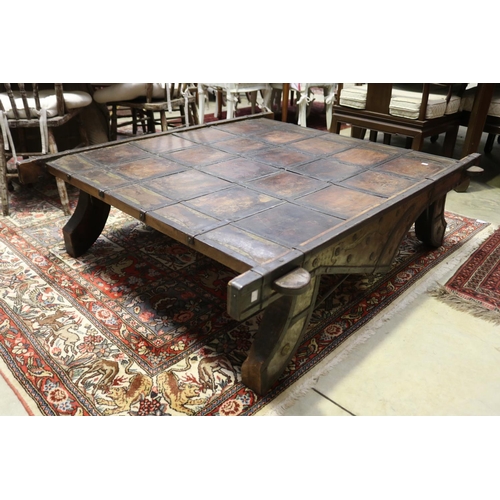 400 - Large Indian cart top coffee table, with applied hand beaten brass and steel decoration, approx 41cm... 