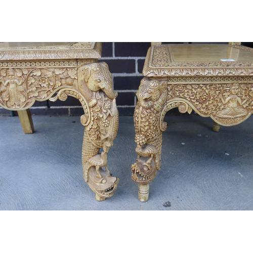 367 - Two similar of profusely carved Thai teak chairs (2)