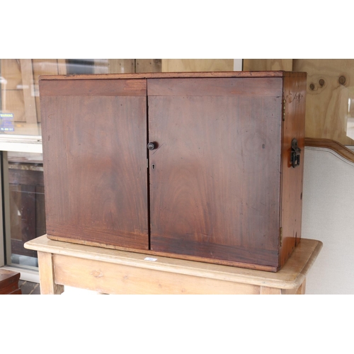 388 - Antique mahogany campaign stationary two door cabinet, fitted with two small internal drawers, iron ... 