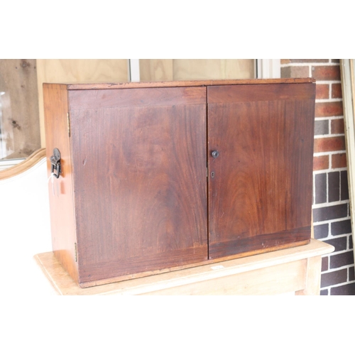 388 - Antique mahogany campaign stationary two door cabinet, fitted with two small internal drawers, iron ... 