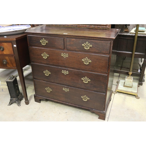 453 - Antique English oak five drawer country chest, fitted with pierced brass drop bale handles, all stan... 