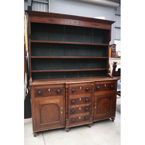 512 - Antique early 19th century English oak two height dresser. Open inlaid shelf top, over a base with c... 