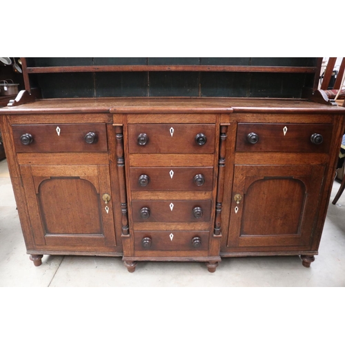 512 - Antique early 19th century English oak two height dresser. Open inlaid shelf top, over a base with c... 