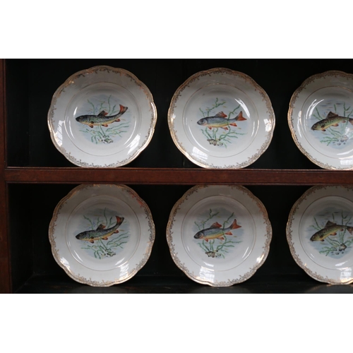 513 - French porcelain fish service, comprising set of 12 plates, each decorated with various species of f... 