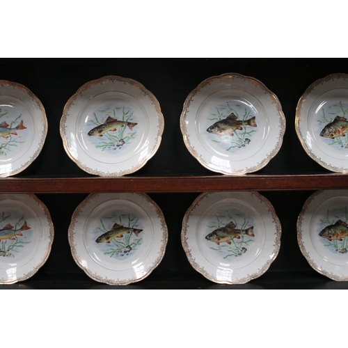 513 - French porcelain fish service, comprising set of 12 plates, each decorated with various species of f... 