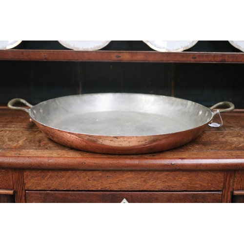 517 - Large heavy French circular twin handled copper shallow pan, with brass handles, impressed made in F... 