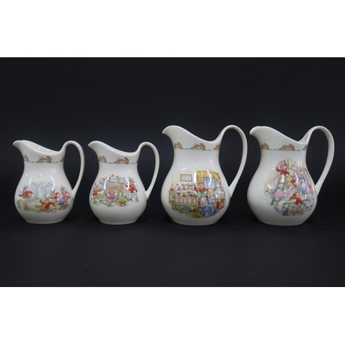 5141 - Royal Doulton, Bunnykins two large and two medium jugs, approx 15cm H & smaller