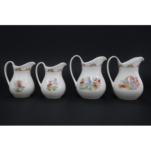 5141 - Royal Doulton, Bunnykins two large and two medium jugs, approx 15cm H & smaller