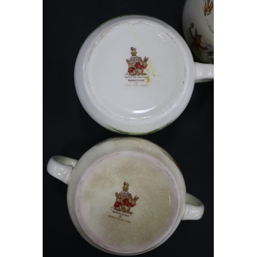 5143 - Royal Doulton, Bunnykins two handle mugs and four singles, approx 7.5cm H each (5)