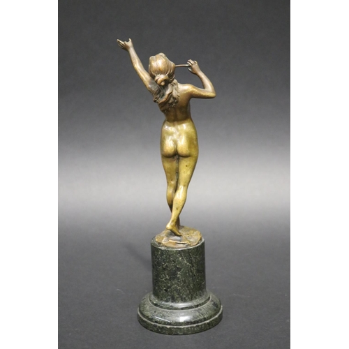 357 - Fine antique bronze of a nude female flute player, mounted to a turned marble pedestal, signed indis... 