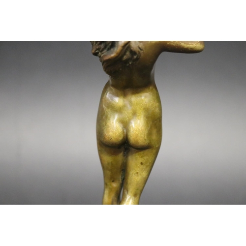 357 - Fine antique bronze of a nude female flute player, mounted to a turned marble pedestal, signed indis... 