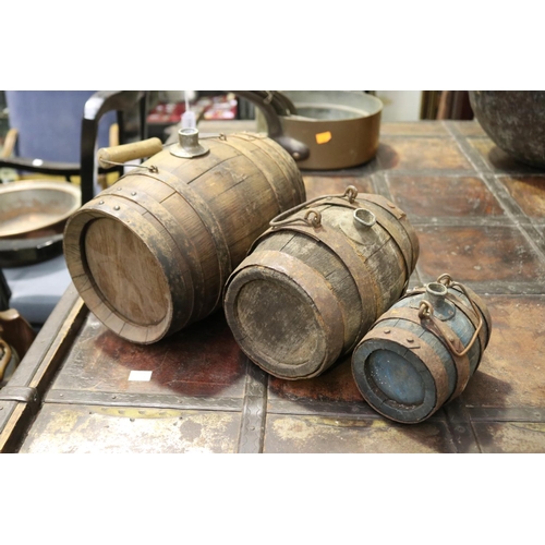 402 - Set of three antique French graduating size oak and iron bound hand barrels, each with carry handles... 