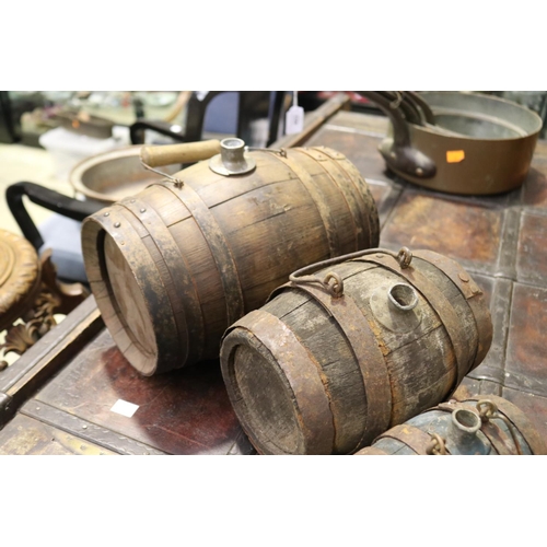 402 - Set of three antique French graduating size oak and iron bound hand barrels, each with carry handles... 