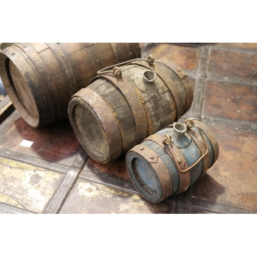 402 - Set of three antique French graduating size oak and iron bound hand barrels, each with carry handles... 