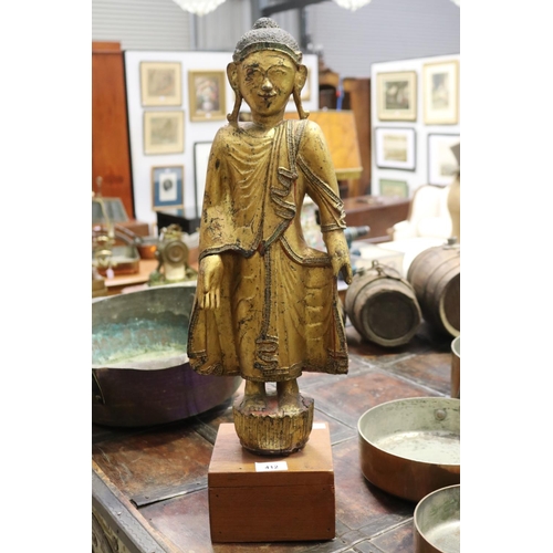 412 - Standing antique gilt wood Thai Buddha, approx 64cm H including stand