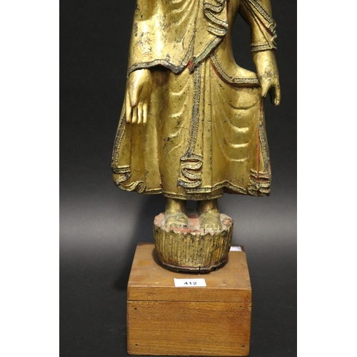 412 - Standing antique gilt wood Thai Buddha, approx 64cm H including stand