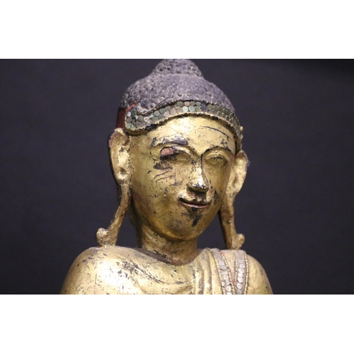 412 - Standing antique gilt wood Thai Buddha, approx 64cm H including stand