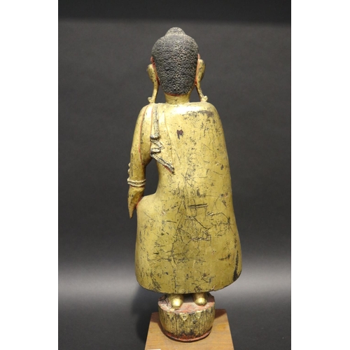 412 - Standing antique gilt wood Thai Buddha, approx 64cm H including stand