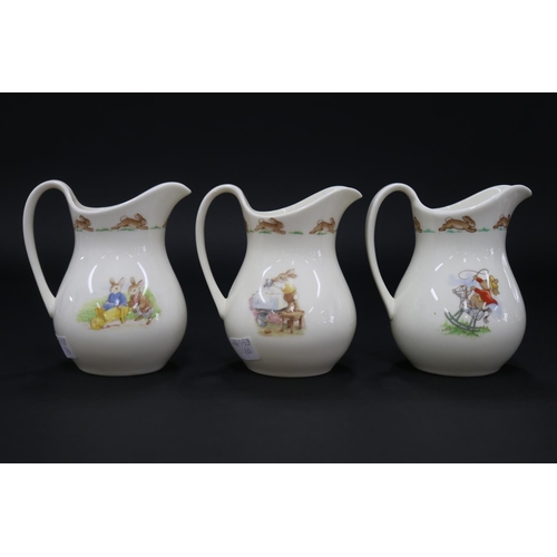 5225 - Royal Doulton, Bunnykins three small milk jugs, approx 12.5cm H each
