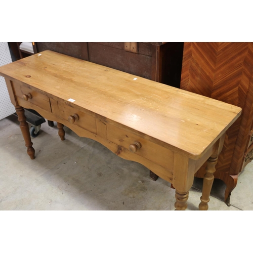 526 - English pine three drawer sideboard/table, approx 77cm H x 151cm W x 46cm D