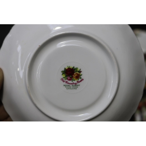 5045 - Royal Albert Old English Roses to include tea cups, saucers and sandwich plates for six