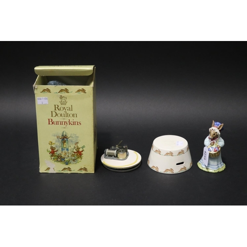 5233 - Royal Doulton Easter parade music box needs attended (needs glue), approx 19cm H