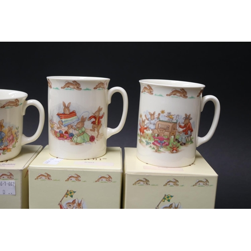 5237 - Four Royal Doulton mugs and a money box, approx 8cm H and shorter (5)